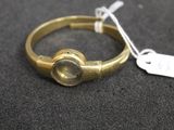 an image of a gold ring with a stone in the middle