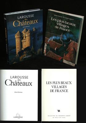 three books on a black background with a castle in the background