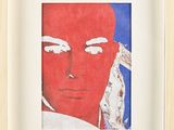 tableau représentant un homme au visage rouge, dans un cadre blanc