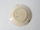 a white plate with a brown design on it