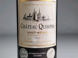 a bottle of wine that is sitting on a table
