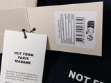a t - shirt with a tag on it that says not from paris madame