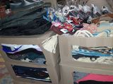 boxes of clothing are stacked on top of each other in a warehouse