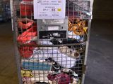 a metal cart with many items in it in a warehouse