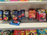a lot of children ' s books on the shelves in the store
