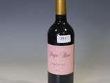 a bottle of wine that is sitting on a table