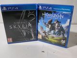 two ps4 games on a table with a white background