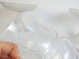 a person that is holding a plastic object in their hand