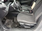 the interior of a car with the door open and the driver ' s seat down
