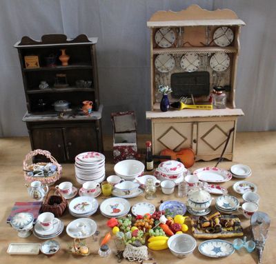 a lot of plates and bowls on the table