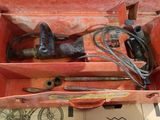 a box with tools in it sitting on a table