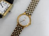 an image of a couple of watches sitting on top of a table