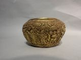 gold plated bowl with a scene of a man and a woman in a garden