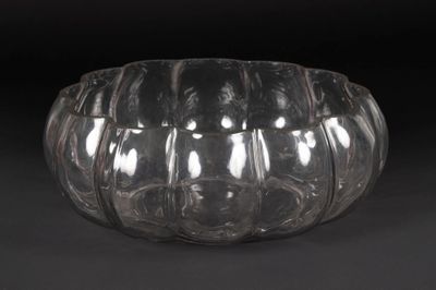 a clear glass bowl that is sitting on a table