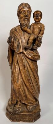 an image of a statue of a man holding a child