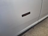 a close up of a car door with a sticker on it