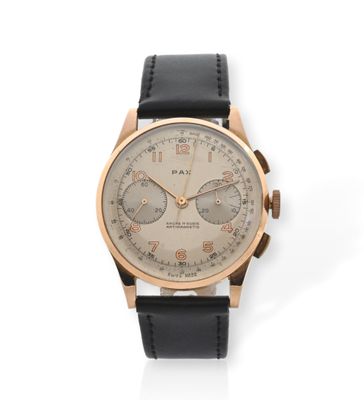 un gros plan d'une montre sur une surface blanche avec un fond blanc