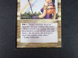 a picture of a card with a picture of a woman holding a sword