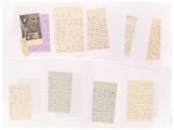 several pieces of paper with handwriting and pictures on them on a white surface