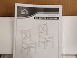 a box with two chairs and a table in it