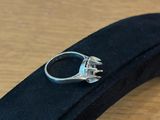 a ring that is sitting on top of a black case