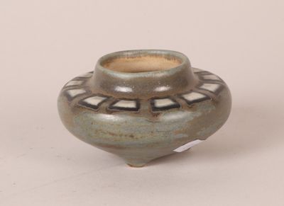 a small vase that is sitting on a table