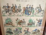 two framed pictures of horses and riders on display