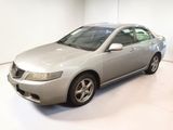 a picture of a silver car in a white room