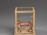 a small wooden box with a glass case on it