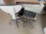 two chairs sitting next to each other in a room