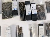 a lot of drill bits that are on the table