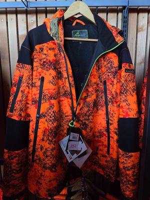 an orange and black jacket hanging on a rack in a store