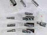 a lot of different types of drill bits on the table