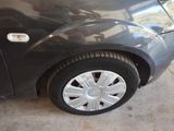 a picture of a car that is parked in a garage