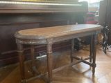 a piano in the corner of a room next to a piano