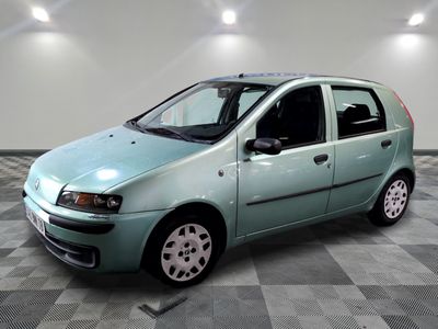 a picture of a small blue car in a room
