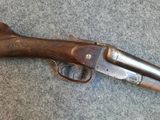 an old gun that is laying on the ground