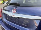 a blue car that has a fiat logo on it