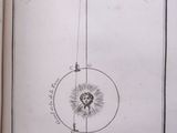 an old book with a drawing of a sun and a man on a horse