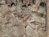 a picture of a wood carving of a man and a woman