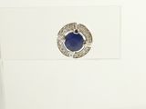 a picture of a ring with a blue stone in it