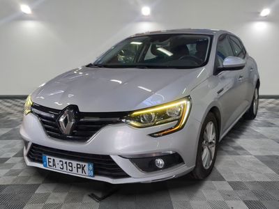 the front of a silver car in a room with checkered floor