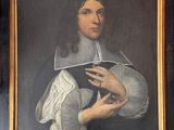 painting of a man holding a book in his right hand