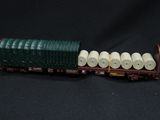 a toy train with rolls of toilet paper on top of it
