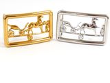 two gold and silver belt buckles with a horse and carriage design