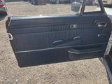 a car door with the door handle open and the door handle missing