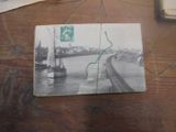 une photo d'une carte postale sur laquelle figure l'image d'un bateau