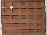 a brick wall with a hole in it that has a sticker on it
