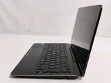 a black laptop with a black keyboard on a white surface