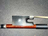 a pipe and a wooden stick on a black surface
